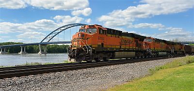 Red train by the Mississippi river